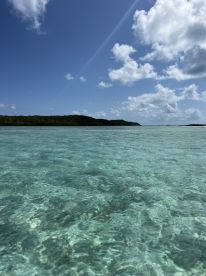 A scenic view of clear waters and distant land, capturing the serene beauty of a tropical destination.