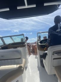 A lively group enjoys a boat ride, capturing the essence of fun and adventure on the water. Perfect for family outings or group excursions.