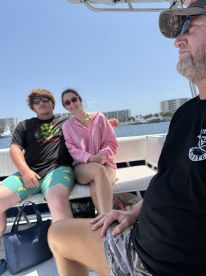 A group of friends enjoys a day out on the boat, capturing the essence of fun and camaraderie on the water.