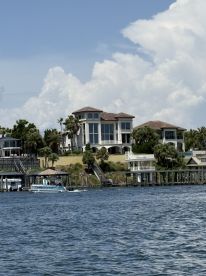 A view of a waterfront property with a boat nearby, but the main subject is unclear due to the framing.