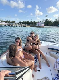 A group of friends enjoys a fun day on the boat, capturing joyful moments together in the sun — perfect for summer outings and celebrations.