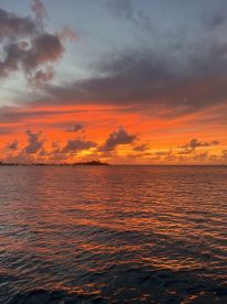 A breathtaking sunset over the water, casting vibrant hues across the sky and reflecting on the waves — a perfect backdrop for evening boat trips or romantic getaways.