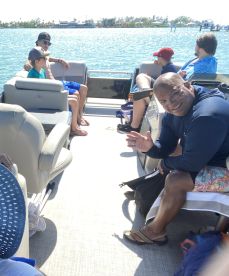 A lively group enjoys a day on the water aboard a pontoon boat, creating lasting memories with family and friends.