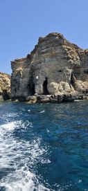 A stunning view of rocky cliffs along the coastline, showcasing the natural beauty of the area — perfect for scenic boat tours.