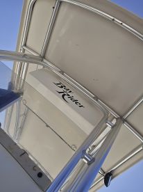 A close-up view of the helm area on a Bay Rider boat, showcasing the sleek design and functionality of the console.