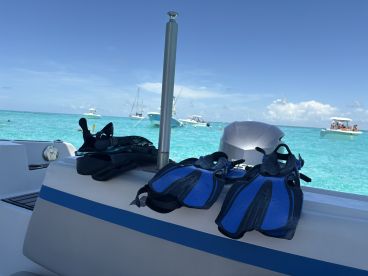 A close-up view of snorkel gear laid out on a boat, ready for an exciting underwater adventure in crystal-clear waters.
