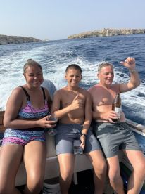 A joyful family enjoys a day on the water, capturing the essence of fun and relaxation while boating together.