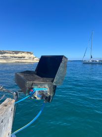 Close-up of a mounted grill on a boat, showcasing onboard amenities for cooking while enjoying the open water.