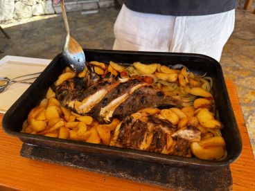 A delicious platter of roasted fish and potatoes, perfect for onboard dining experiences or catering during a boat trip.