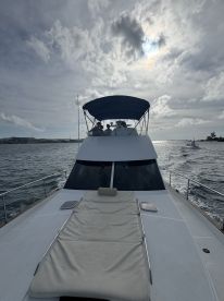 A group of guests enjoys a scenic ride aboard a yacht, showcasing the perfect blend of relaxation and adventure on the water.