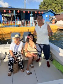 A cheerful group enjoys their time on a boat, capturing the essence of fun and celebration on the water.
