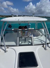A family enjoys a day on the water aboard a boat, showcasing a fun and relaxing atmosphere perfect for creating lasting memories.