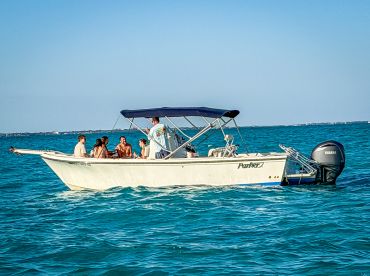 A lively group enjoys a day on the water aboard a Parker boat, perfect for fun and relaxation in the sun.