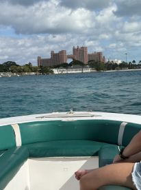 A scenic view from a boat showcasing the stunning Atlantis hotel in the background, perfect for capturing the essence of a tropical getaway.