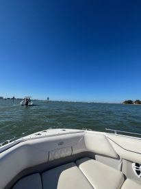 A view of the comfortable seating area inside a boat, showcasing a relaxing atmosphere on the water.