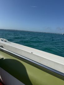 The image captures a portion of a boat's interior with a view of the water, but the angle and focus make it unclear.