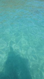 An unclear image of turquoise water, lacking identifiable features or subjects.