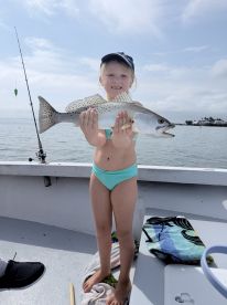 captain was patient with granddaughter teaching her to fish