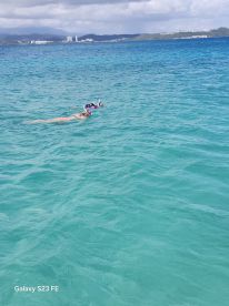 Two snorkelers explore the vibrant underwater world in crystal-clear waters, showcasing the beauty of marine life and perfect for adventure seekers.