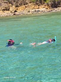 Two snorkelers explore the vibrant underwater world in clear turquoise waters, making for an unforgettable aquatic adventure.