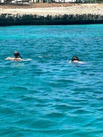 Two snorkelers explore the vibrant underwater world in crystal-clear waters, perfect for aquatic adventures and marine life encounters.