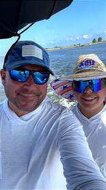 A joyful moment captured of a family enjoying a boating adventure, showcasing smiles and fun under the sun.