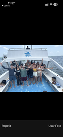 A lively group of friends poses on the deck of a boat, celebrating together in a fun-filled outing on the water.