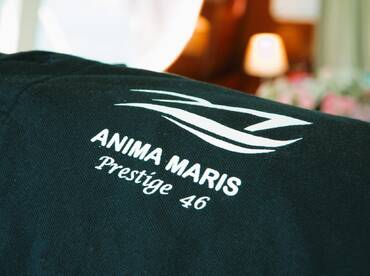 Close-up of the logo on a fabric item related to the Anima Maris Prestige 46, showcasing branding details.