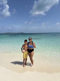A joyful moment captured on the beach with a mother and her son, showcasing family fun in the sun — perfect for memorable beach outings.