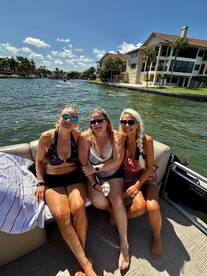 A group of friends enjoys a sunny day on the water, capturing the perfect moment aboard a boat — ideal for fun outings and memorable experiences.