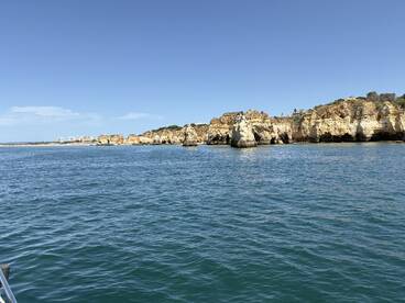 A stunning view of the rugged coastline and cliffs, showcasing the natural beauty of the area — perfect for sightseeing and exploring by boat.