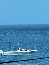 A group enjoys a day on the water aboard a boat, making the most of their aquatic adventure.