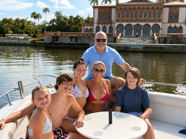 A joyful family poses together on a boat, enjoying a sunny day on the water — perfect for creating lasting memories during their aquatic adventures.
