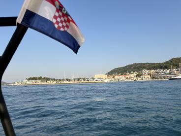 A picturesque view of a Croatian harbor, showcasing the vibrant coastline and marina, perfect for exploring the beauty of the Adriatic Sea.