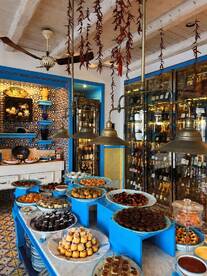 A beautifully arranged display of desserts and snacks in a vibrant setting, perfect for catering on board or at events.