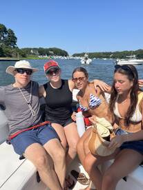 A group of friends enjoys a sunny day on the boat, capturing the essence of summer fun and camaraderie on the water.