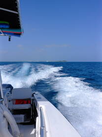 A dynamic view from the helm of a speedboat cutting through vibrant blue waters, showcasing the thrill of boating adventures.