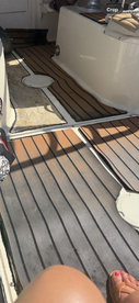 A cozy view of the interior cabin flooring on a boat, showcasing the inviting space for relaxation and comfort while on the water.