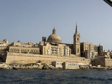 A stunning view of the historic skyline of Valletta, Malta, showcasing its iconic architecture along the coastline — perfect for sightseeing and cultural exploration.