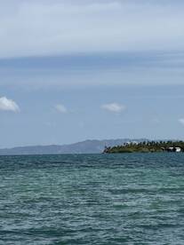 A scenic view of the water and distant land, but the image lacks clarity and detail.