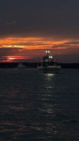 The Atlantic Star navigates through shimmering waters at sunset, creating a picturesque scene perfect for evening cruises.