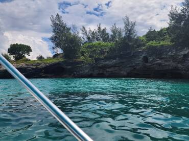 A picturesque view of a rocky coastline surrounded by vibrant turquoise waters, perfect for exploring the natural beauty of the area.