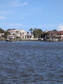 A view of waterfront properties with a focus on the water, but the image lacks clarity and detail.