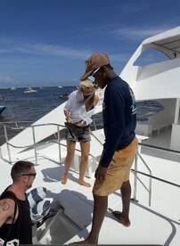 A lively group enjoys their time aboard a boat, showcasing the fun and camaraderie of a day on the water.