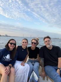 A group of friends enjoys a scenic boat ride, capturing the essence of camaraderie and adventure on the water.