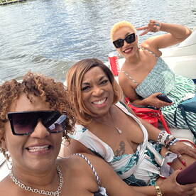 A joyful group of friends enjoys a fun day on the water, capturing smiles and laughter while boating together.