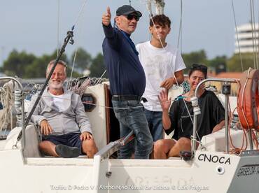 A cheerful group enjoys a sailing experience, showcasing camaraderie and fun aboard their boat. Perfect for family outings or group adventures on the water.